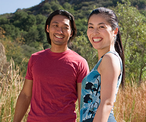 man and woman in nature smiling