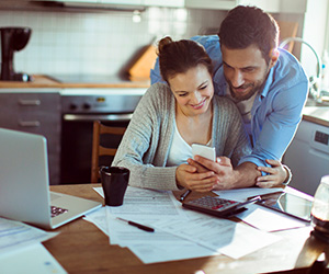 man and woman doing calculations